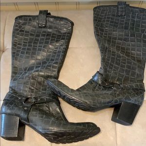 Tall, all leather textured black boots